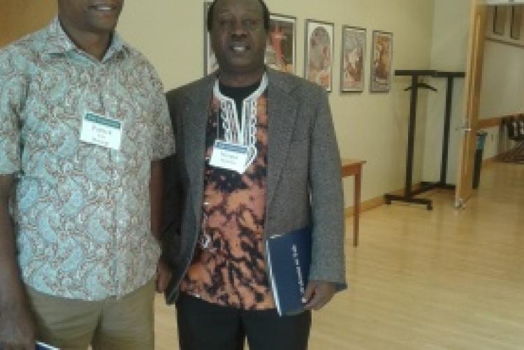 Prof. Iribe Mwangi, Chairman of the Department of Kiswahili and Prof. Mungai Mutonya from Washington University pose for a photo at a Kiswahili Conference held in Yale University.